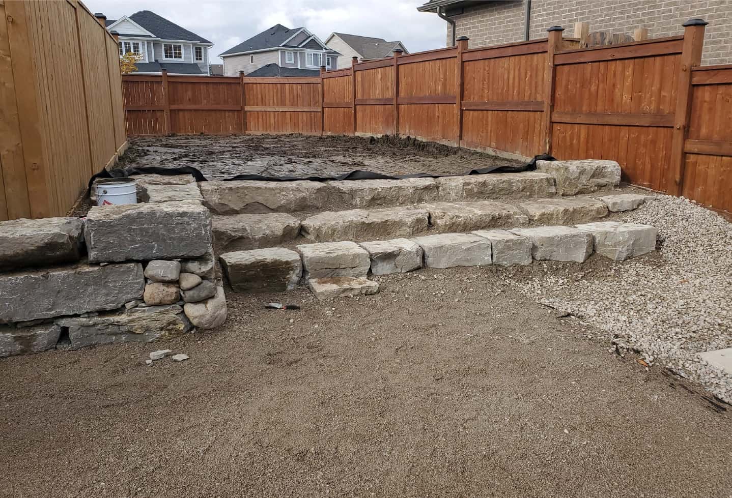 backyard stone steps, exposed ground in preparation for landscaping and hardscaping project