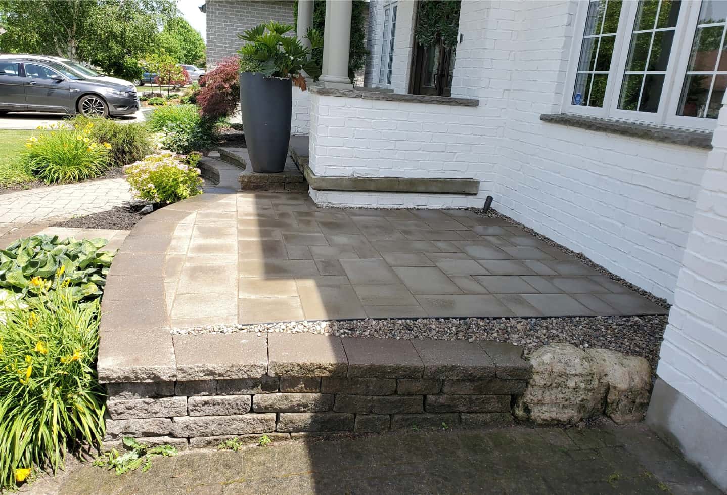 newly installed stone hardscape step feature in front of house