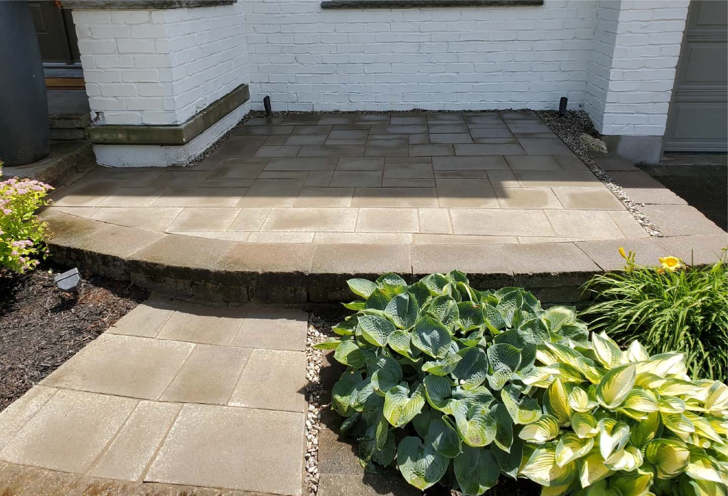 newly installed stone hardscape step feature in front of house
