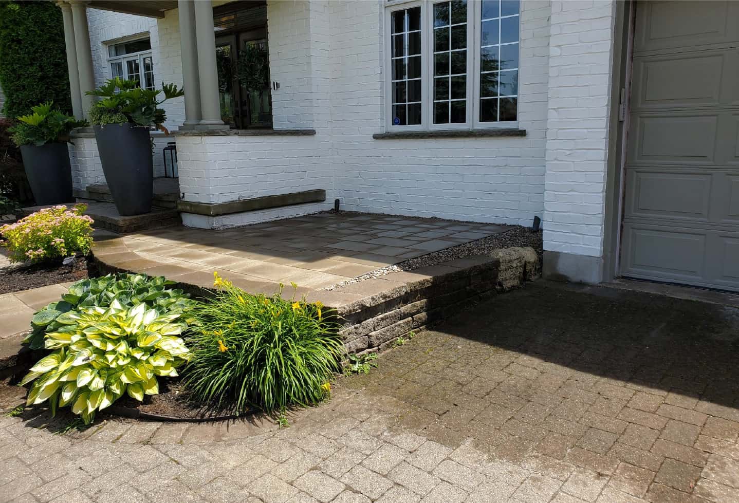 newly installed stone hardscape step feature in front of house