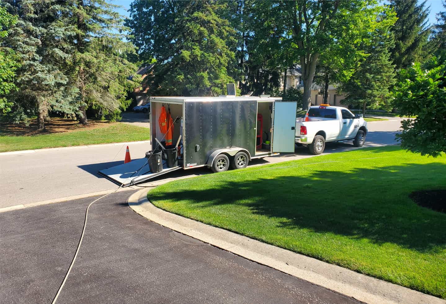 mobile power washing van parked on street
