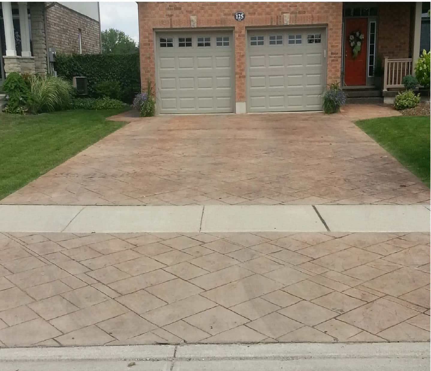 stone tile hardscape driveway of double garage before treatment